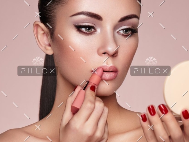 demo-attachment-1165-beautiful-woman-paints-lips-with-lipstick-PMB6YWP-1